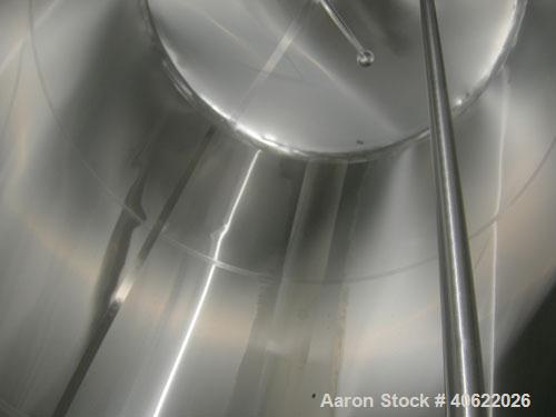 Used DCI tank, 4500 gallon, 304 stainless steel, jacketed. 89 1/4" diameter x 168" straight side. Dish top, sloped bottom. 22" bottom sidewall dimple jacket rated 150 psi @ 100 degrees F. Top opening...