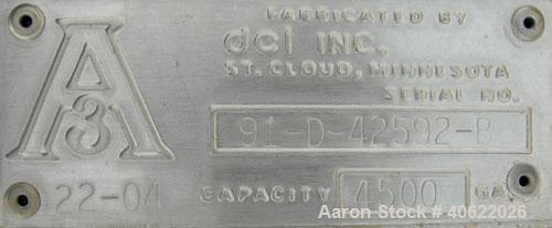 Used DCI tank, 4500 gallon, 304 stainless steel, jacketed. 89 1/4" diameter x 168" straight side. Dish top, sloped bottom. 22" bottom sidewall dimple jacket rated 150 psi @ 100 degrees F. Top opening...