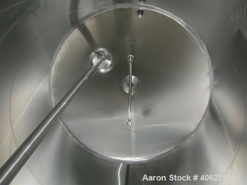 Used DCI tank, 4500 gallon, 304 stainless steel, jacketed. 89 1/4" diameter x 168" straight side. Dish top, sloped bottom. 22" bottom sidewall dimple jacket rated 150 psi @ 100 degrees F. Top opening...