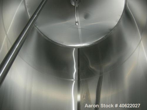 Used DCI tank, 4500 gallon, 304 stainless steel, jacketed. 89 1/4" diameter x 168" straight side. Dish top, sloped bottom. 22" bottom sidewall dimple jacket rated 150 psi @ 100 degrees F. Top opening...