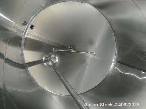 Used DCI tank, 4500 gallon, 304 stainless steel, jacketed. 89 1/4" diameter x 168" straight side. Dish top, sloped bottom. 22" bottom sidewall dimple jacket rated 150 psi @ 100 degrees F. Top opening...