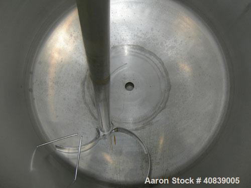 Used Tank, 1000 Gallon, 316 Stainless Steel, Vertical. 64" diameter x 64" straight side.  Dish top and bottom. Openings:  Top 18" manway with plastic cover, 2", (2) 4", 2 1/2", 4" drive, 8";  3" cent...