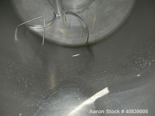 Used Tank, 1000 Gallon, 316 Stainless Steel, Vertical. 64" diameter x 64" straight side.  Dish top and bottom. Openings:  Top 18" manway with plastic cover, 2", (2) 4", 2 1/2", 4" drive, 8";  3" cent...