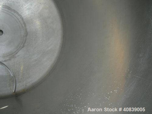 Used Tank, 1000 Gallon, 316 Stainless Steel, Vertical. 64" diameter x 64" straight side.  Dish top and bottom. Openings:  Top 18" manway with plastic cover, 2", (2) 4", 2 1/2", 4" drive, 8";  3" cent...