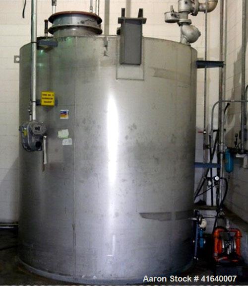 Used Tank, 3,000 gallon, Stainless steel, vertical.  Flat top, sloped bottom - full drain; UL listed aboveground tank for flammable liguids.  Tank Accessories: Protectoseal manhole & emergency pressu...