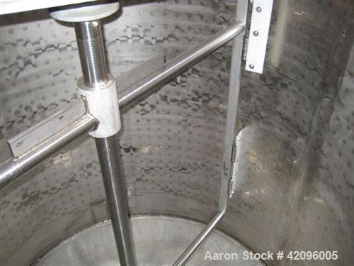 Used Open top 1200 gallons jacketed mixing tank 74" deep x 68" diameter, tapered bottom with a 3" drain stainless steel, steel legs, mixer head: type 1602, ration R 70/1, motor: 10 hp, 208/230/460 vo...