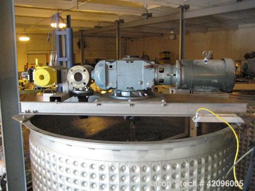 Used Open top 1200 gallons jacketed mixing tank 74" deep x 68" diameter, tapered bottom with a 3" drain stainless steel, steel legs, mixer head: type 1602, ration R 70/1, motor: 10 hp, 208/230/460 vo...