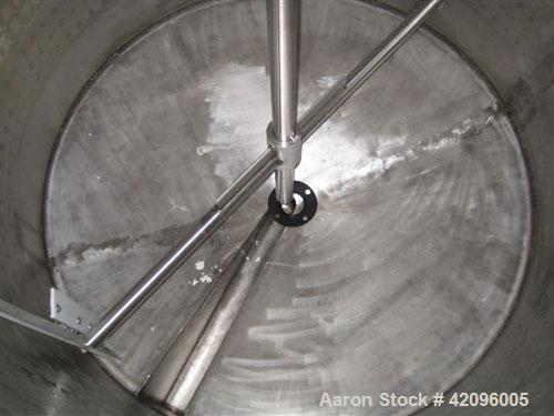 Used Open top 1200 gallons jacketed mixing tank 74" deep x 68" diameter, tapered bottom with a 3" drain stainless steel, steel legs, mixer head: type 1602, ration R 70/1, motor: 10 hp, 208/230/460 vo...