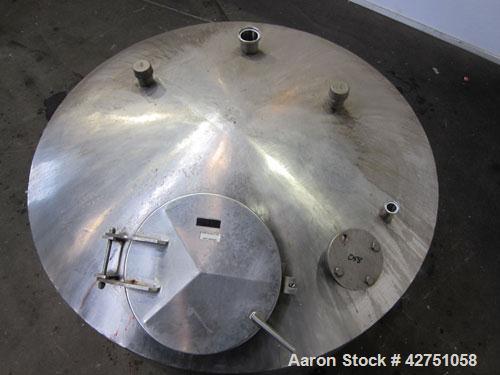 Used Tank, 1000 Gallon, 304 Stainless Steel, Vertical. 66" Diameter x 66" straight side, dished top, coned bottom. Openings top 1-1/2", (2) 2" NPT, (2) 3", 18" man way with cover. 2" Tri-clamp center...