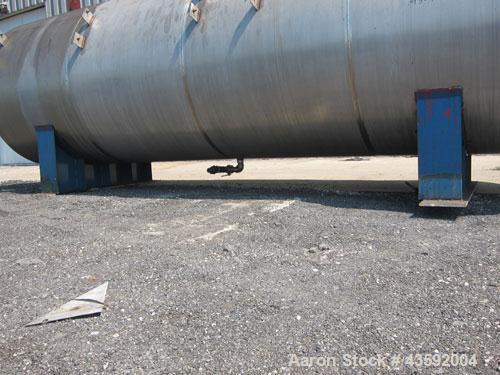 Used Tank, 4900 Gallon, 304 Stainless Steel, Horizontal. 78" Diameter x 240" straight side, flat ends. Openings: top (2) 2-3/8" threaded, (2) 3-1/4", 18" manway with cover; end 2"; bottom (3) approxi...