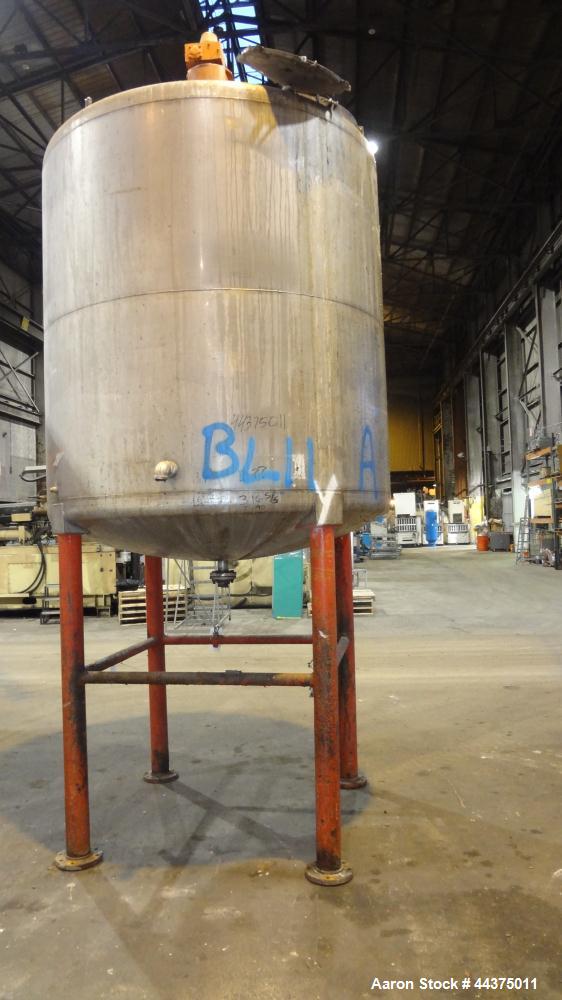 Used Tank, 1500 Gallon, 316 Stainless Steel, Vertical. Approximate 76" diameter x 72" straight side, dished top and bottom. Top entering ProQuip agitator, model  75JLS20, serial# 8287, ratio 20 to 1,...