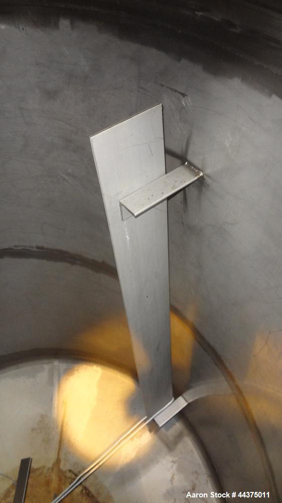 Used Tank, 1500 Gallon, 316 Stainless Steel, Vertical. Approximate 76" diameter x 72" straight side, dished top and bottom. Top entering ProQuip agitator, model  75JLS20, serial# 8287, ratio 20 to 1,...
