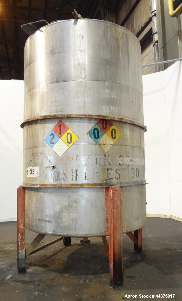 Used Tank, 3000 Gallon, 304 Stainless Steel, Vertical. Approximate 84" diameter x 118" straight side, flat welded top, coned bottom. Fixed carbon steel agitator bridge with a Lightnin agitator, model...