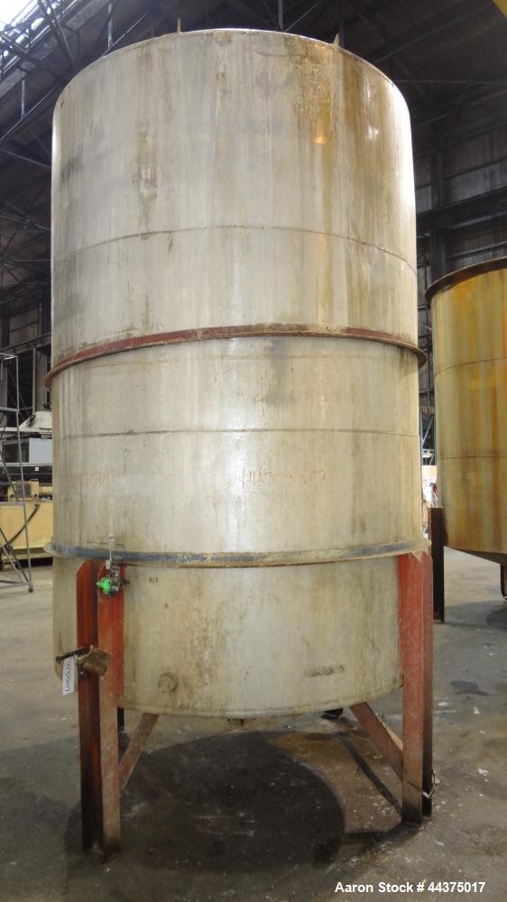 Used Tank, 3000 Gallon, 304 Stainless Steel, Vertical. Approximate 84" diameter x 118" straight side, flat welded top, coned bottom. Fixed carbon steel agitator bridge with a Lightnin agitator, model...