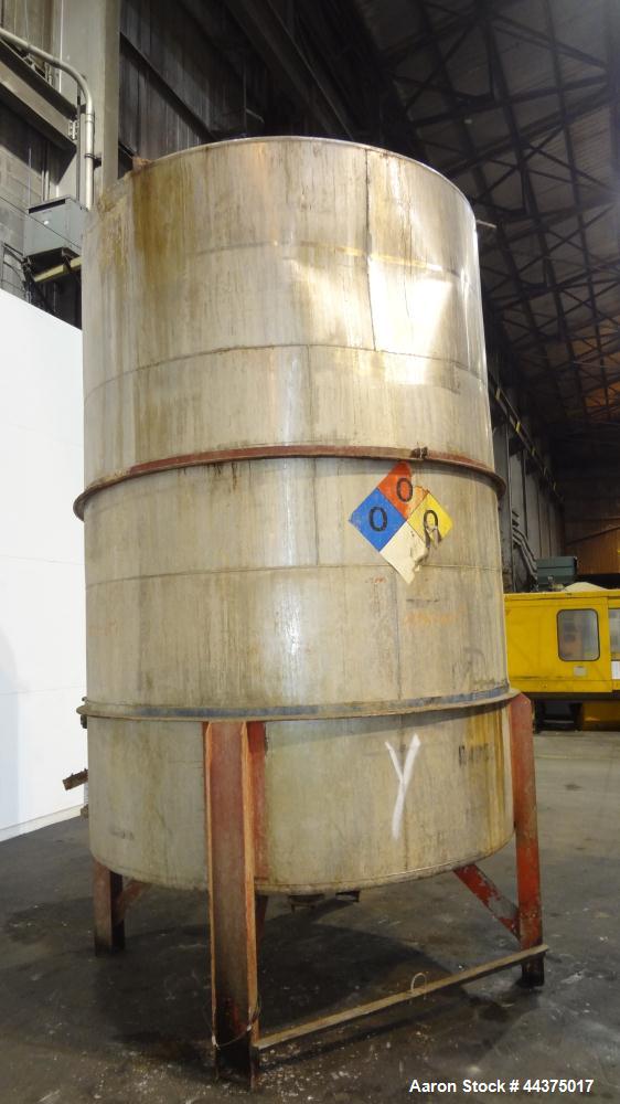 Used Tank, 3000 Gallon, 304 Stainless Steel, Vertical. Approximate 84" diameter x 118" straight side, flat welded top, coned bottom. Fixed carbon steel agitator bridge with a Lightnin agitator, model...