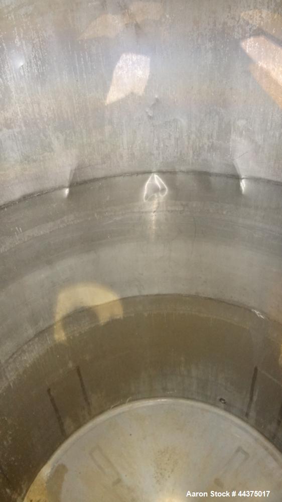 Used Tank, 3000 Gallon, 304 Stainless Steel, Vertical. Approximate 84" diameter x 118" straight side, flat welded top, coned bottom. Fixed carbon steel agitator bridge with a Lightnin agitator, model...