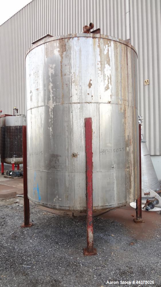 Used Tank, 4000 Gallon, 316 Stainless Steel, Vertical. Approximate 102" diameter x 120" straight side, flat welded top, dished bottom. Fixed carbon steel agitator bridge. Openings top 18" x 18" man w...