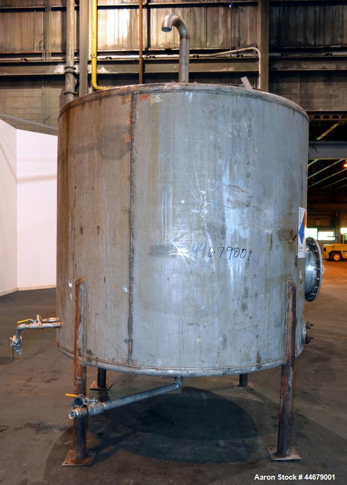 Used Tank, 1800 Gallon, 304 Stainless Steel, Vertical. Approximate 84” diameter x 72” straight side, coned top and bottom. (3) Turns of approximate 2” internal  pipe coil, no rating. (4) Sidewall baf...