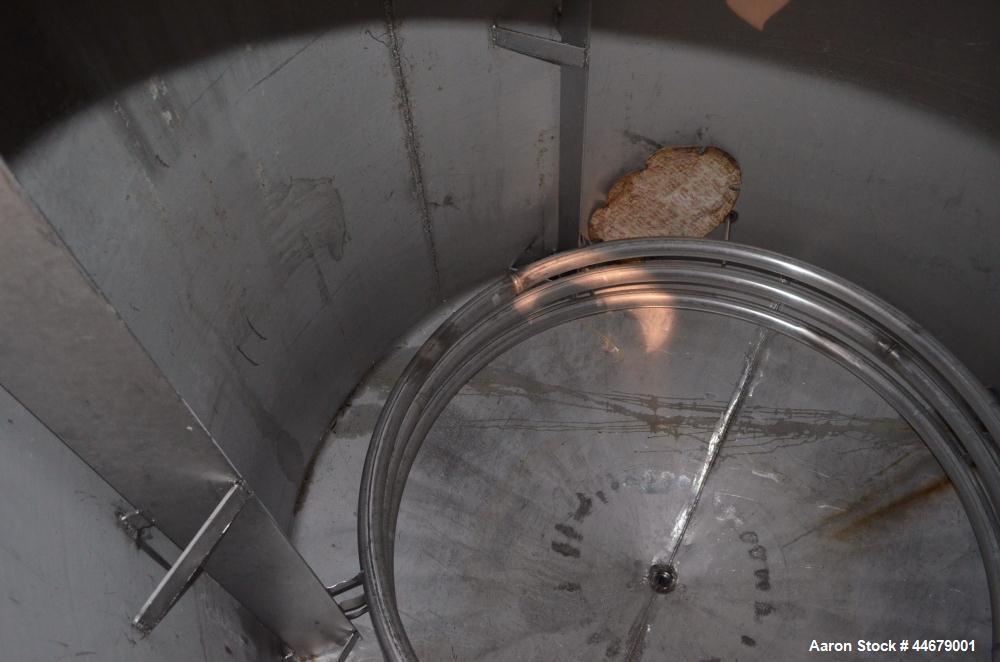 Used Tank, 1800 Gallon, 304 Stainless Steel, Vertical. Approximate 84” diameter x 72” straight side, coned top and bottom. (3) Turns of approximate 2” internal  pipe coil, no rating. (4) Sidewall baf...
