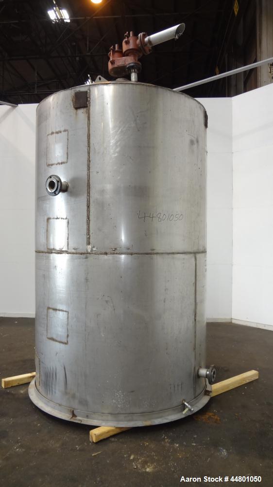 Used Tank, 2300 Gallons, 304 Stainless Steel, Vertical. Approximately 76" diameter x 120" straight side, coned top, flat bottom, 3" side bottom outlet. Tank has (3) large patches on sidewall.