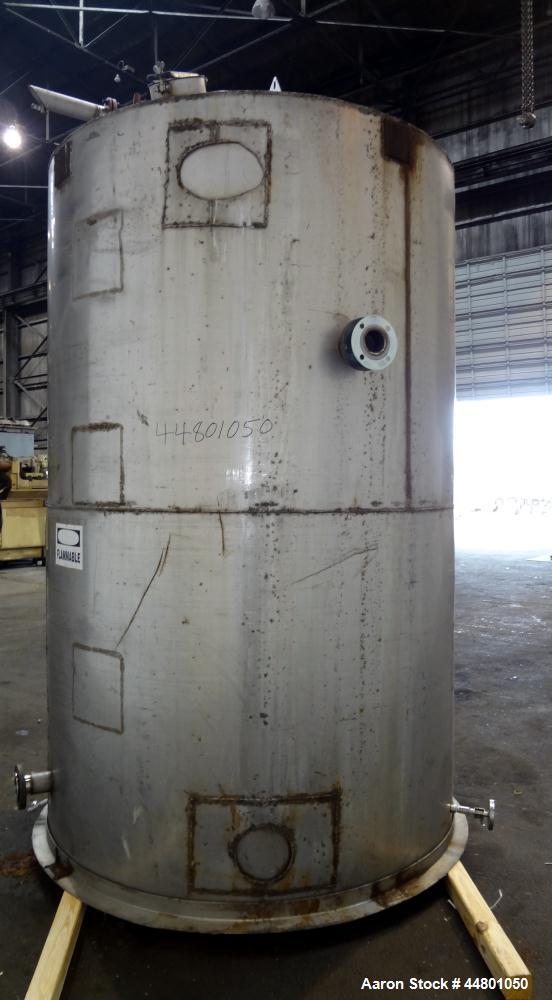Used Tank, 2300 Gallons, 304 Stainless Steel, Vertical. Approximately 76" diameter x 120" straight side, coned top, flat bottom, 3" side bottom outlet. Tank has (3) large patches on sidewall.