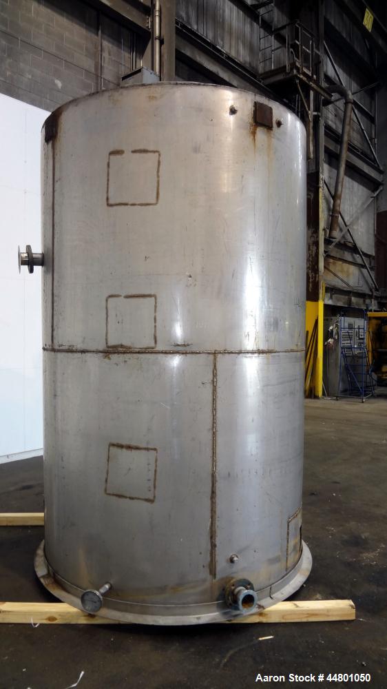 Used Tank, 2300 Gallons, 304 Stainless Steel, Vertical. Approximately 76" diameter x 120" straight side, coned top, flat bottom, 3" side bottom outlet. Tank has (3) large patches on sidewall.
