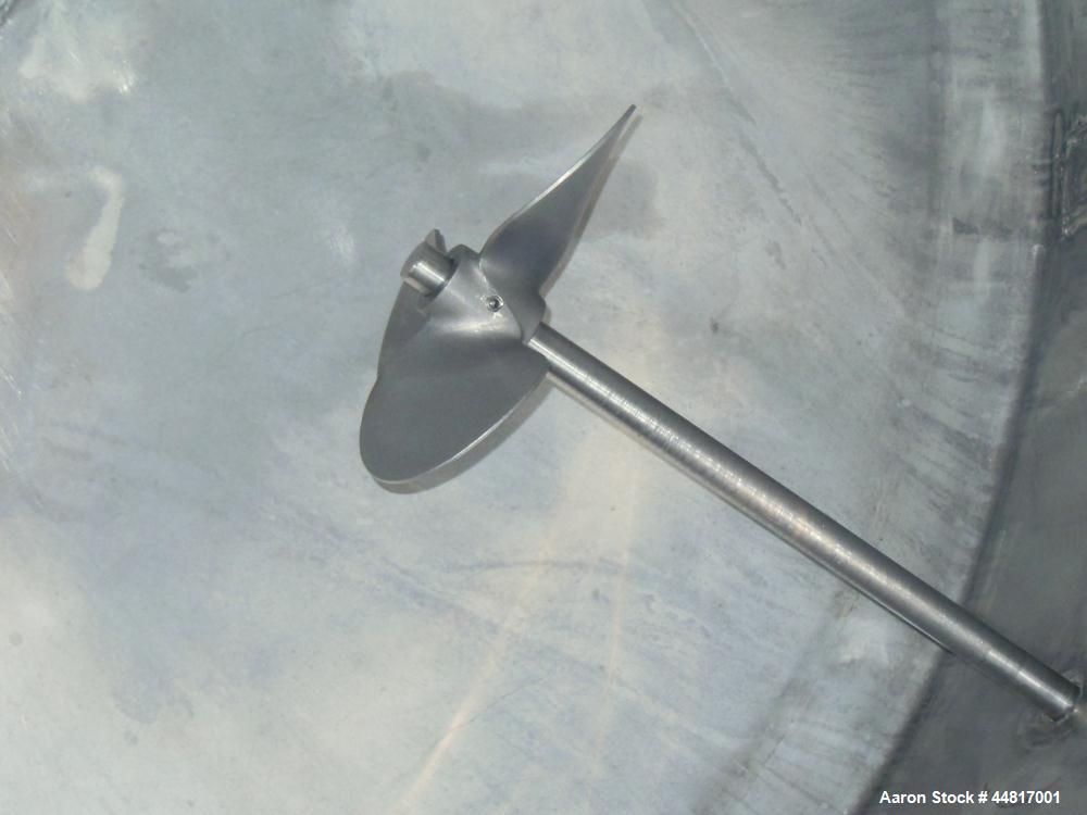 Used Tank, 1000 Gallons, 304 Stainless Steel, Vertical. Approximately 67" diameter x 72" straight side, flat welded top, slight dished bottom. Side bottom entering agitator with a (3) blade prop driv...