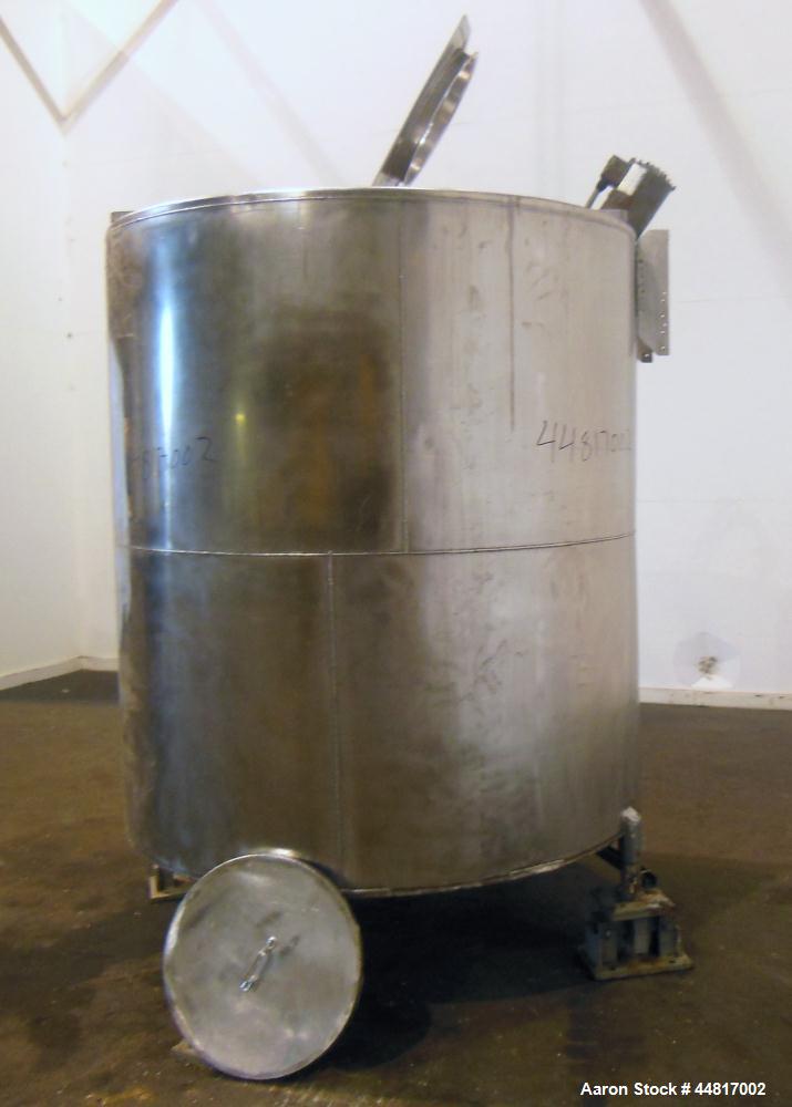 Used Tank, 1000 Gallons, 304 Stainless Steel, Vertical. Approximately 67" diameter x 72" straight side, flat welded top, slight dished bottom. Top entering clamp agitator, 1" diameter shaft with (2) ...