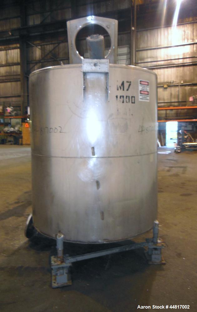 Used Tank, 1000 Gallons, 304 Stainless Steel, Vertical. Approximately 67" diameter x 72" straight side, flat welded top, slight dished bottom. Top entering clamp agitator, 1" diameter shaft with (2) ...
