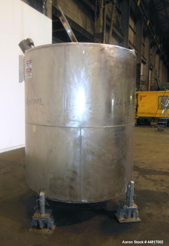 Used Tank, 1000 Gallons, 304 Stainless Steel, Vertical. Approximately 67" diameter x 72" straight side, flat welded top, slight dished bottom. Top entering clamp agitator, 1" diameter shaft with (2) ...