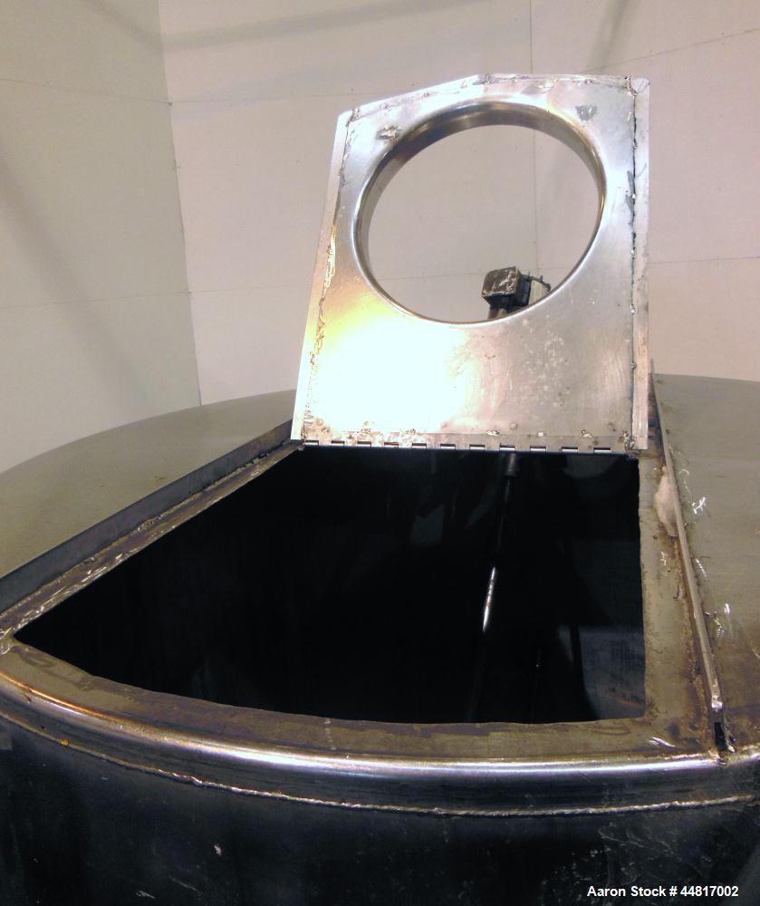 Used Tank, 1000 Gallons, 304 Stainless Steel, Vertical. Approximately 67" diameter x 72" straight side, flat welded top, slight dished bottom. Top entering clamp agitator, 1" diameter shaft with (2) ...
