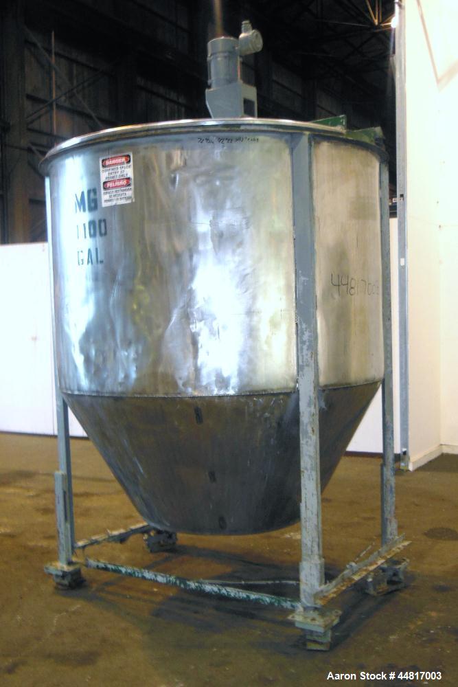 Used Tank, 1000 Gallons, 304 Stainless Steel, Vertical.  Approximately 72" diameter x 42" straight side x 33" cone. Flat open top with (2) 1/2 covers, slight coned bottom.  Fixed carbon steel agitato...