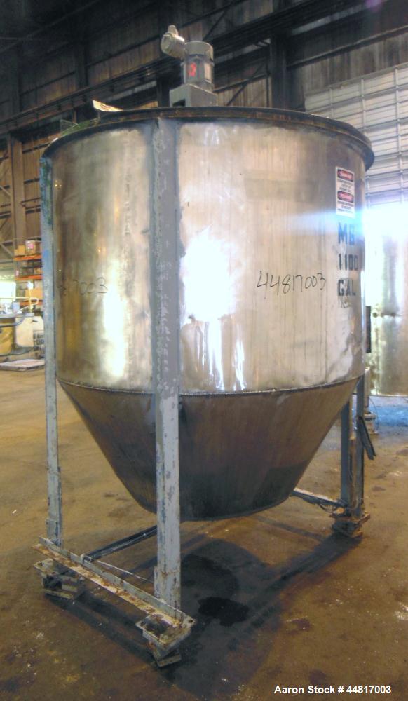 Used Tank, 1000 Gallons, 304 Stainless Steel, Vertical.  Approximately 72" diameter x 42" straight side x 33" cone. Flat open top with (2) 1/2 covers, slight coned bottom.  Fixed carbon steel agitato...