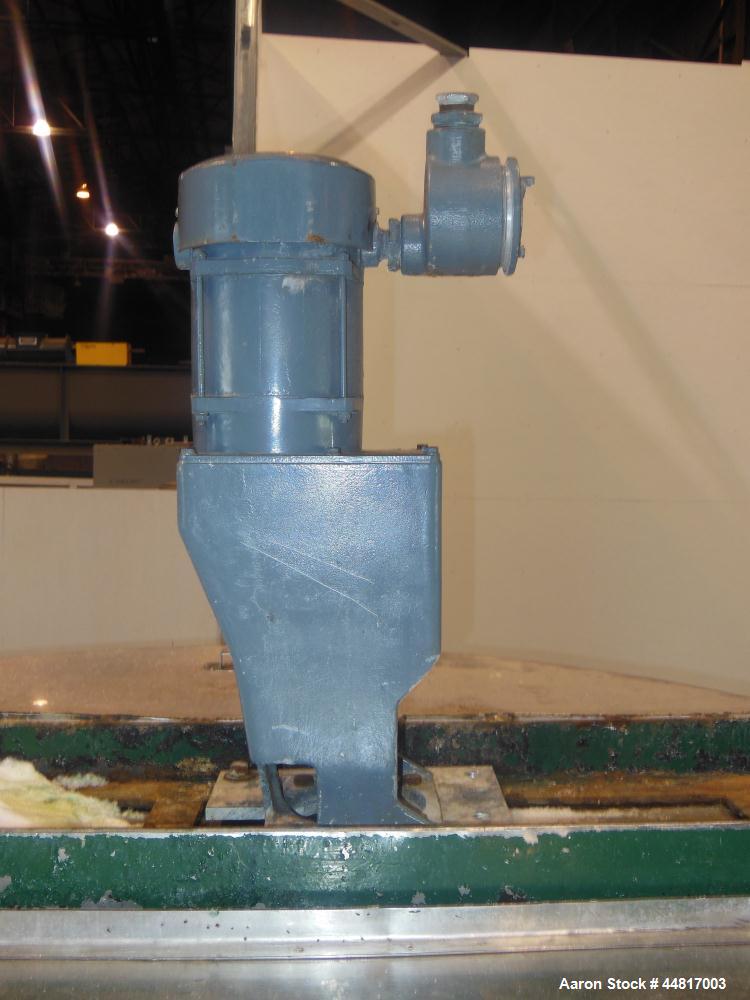 Used Tank, 1000 Gallons, 304 Stainless Steel, Vertical.  Approximately 72" diameter x 42" straight side x 33" cone. Flat open top with (2) 1/2 covers, slight coned bottom.  Fixed carbon steel agitato...
