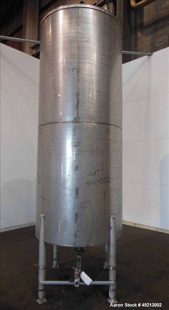 Used Tank, 1100 Gallon, 304 Stainless Steel, Verical. 52" Diameter X 120" straight side. Coned top and bottom. Openings top: 24" X 17" manway with cover, 1 1/2", 2" and 2 1/2".  2 1/2" center bottom ...