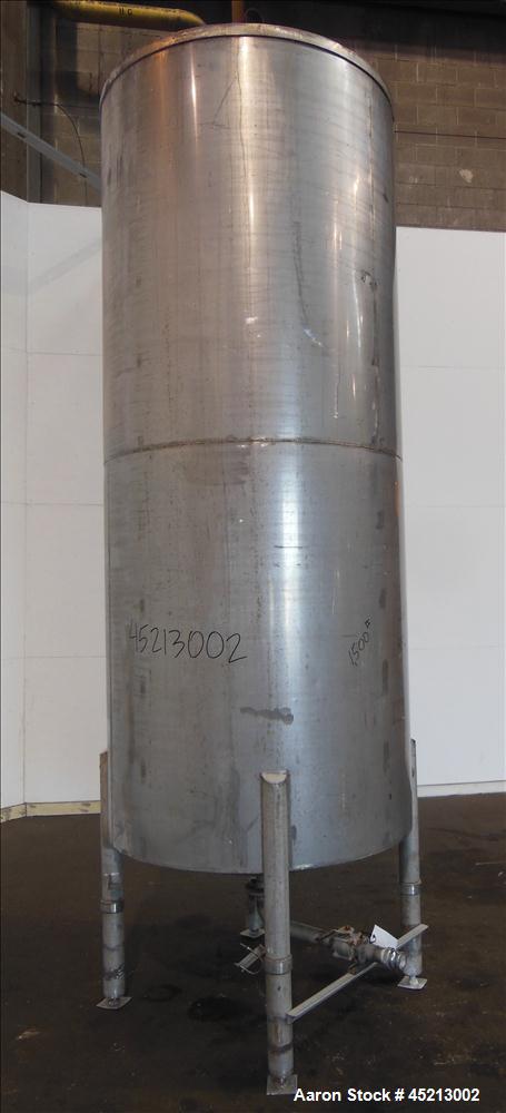 Used Tank, 1100 Gallon, 304 Stainless Steel, Verical. 52" Diameter X 120" straight side. Coned top and bottom. Openings top: 24" X 17" manway with cover, 1 1/2", 2" and 2 1/2".  2 1/2" center bottom ...