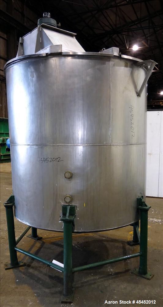 Used Tank, 1,200 Gallons, 304 Stainless Steel, Vertical. Approximate 71" diameter x 71" Straight Side, Flat Top and Dish bottom. Top has agitator bridge  with (3) hinged covers. Lightnin Agitator wit...