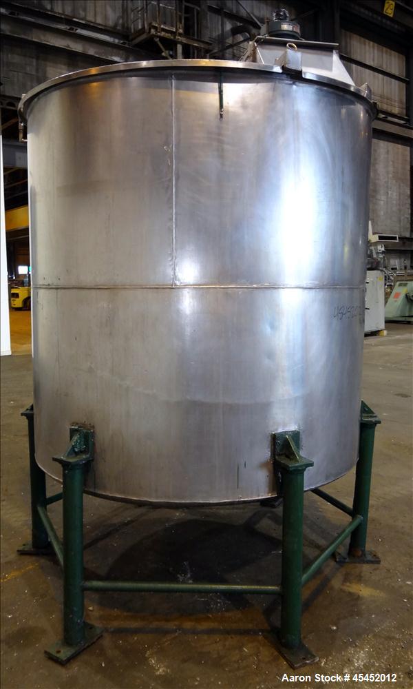Used Tank, 1,200 Gallons, 304 Stainless Steel, Vertical. Approximate 71" diameter x 71" Straight Side, Flat Top and Dish bottom. Top has agitator bridge  with (3) hinged covers. Lightnin Agitator wit...