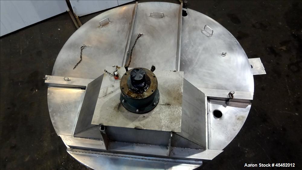Used Tank, 1,200 Gallons, 304 Stainless Steel, Vertical. Approximate 71" diameter x 71" Straight Side, Flat Top and Dish bottom. Top has agitator bridge  with (3) hinged covers. Lightnin Agitator wit...
