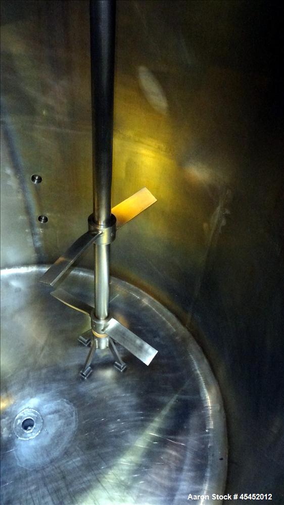 Used Tank, 1,200 Gallons, 304 Stainless Steel, Vertical. Approximate 71" diameter x 71" Straight Side, Flat Top and Dish bottom. Top has agitator bridge  with (3) hinged covers. Lightnin Agitator wit...