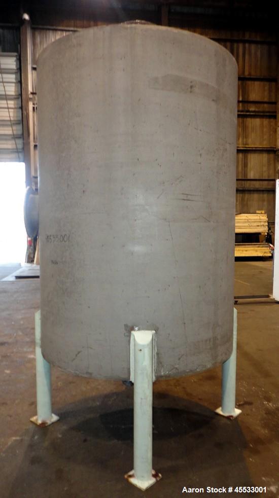 Used 1244 Gallon, 316 Stainless Steel Tank. Approximately 65" diameter x 84" straight side. Dished top and bottom. 10" flange top center opening, 10" side outlet and a 6" center bottom outlet. Mounte...