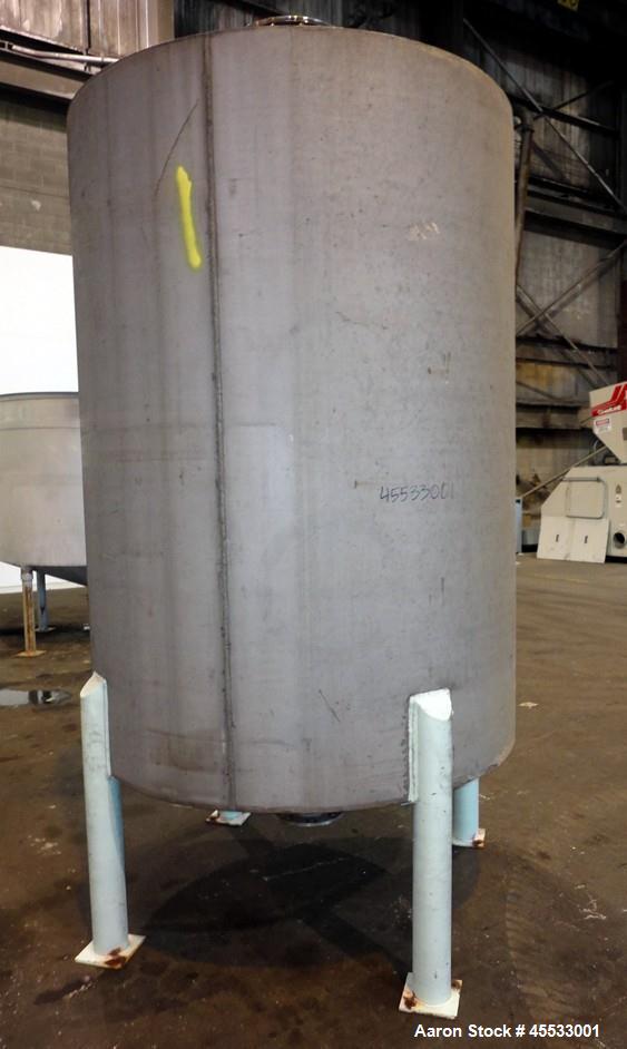 Used 1244 Gallon, 316 Stainless Steel Tank. Approximately 65" diameter x 84" straight side. Dished top and bottom. 10" flange top center opening, 10" side outlet and a 6" center bottom outlet. Mounte...