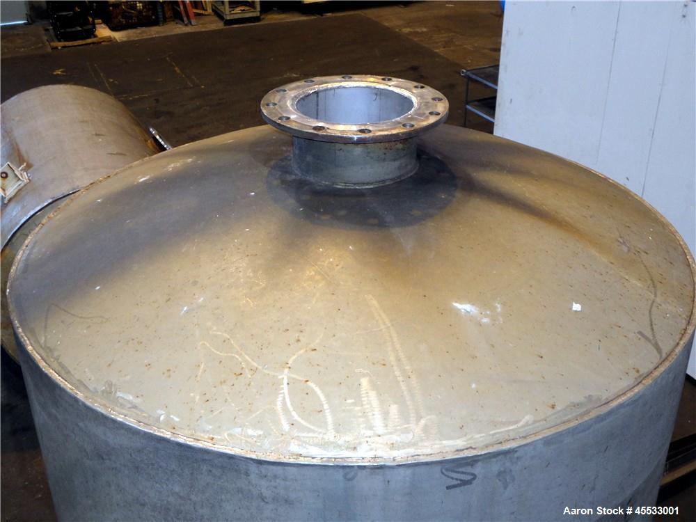 Used 1244 Gallon, 316 Stainless Steel Tank. Approximately 65" diameter x 84" straight side. Dished top and bottom. 10" flange top center opening, 10" side outlet and a 6" center bottom outlet. Mounte...