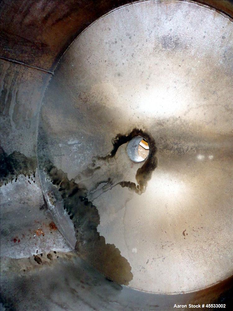 Used 1244 Gallon, 316 Stainless Steel Tank. Approximately 65" diameter x 84" straight side. Dished top and bottom. 10" flange top center opening, 10" side outlet and a 6" center bottom outlet. Includ...