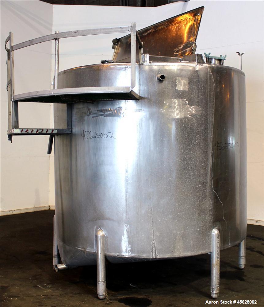 Used Tank, Approximately 2000 Gallons, 304 Stainless Steel, Vertical. Approximately 90" diameter x 74" straight side. Flat top, sloped V-bottom. Has fixed carbon steel agitator mount, no motor, 1-1/2...