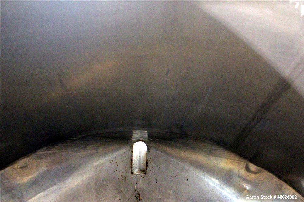 Used Tank, Approximately 2000 Gallons, 304 Stainless Steel, Vertical. Approximately 90" diameter x 74" straight side. Flat top, sloped V-bottom. Has fixed carbon steel agitator mount, no motor, 1-1/2...