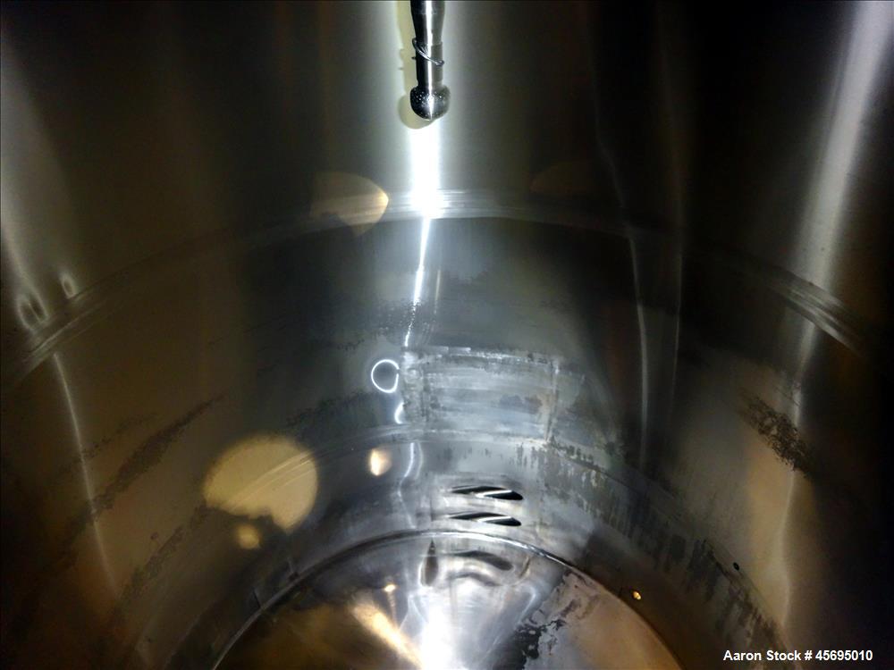Used Tank, 3500 Gallon, 304 Stainless Steel, Vertical. 96" Diameter x 115" straight side, dished top, sloped bottom. (1) Spray Ball. Openings top 4", 8", 16" man way with cover. 4" Tri-clamp side bot...