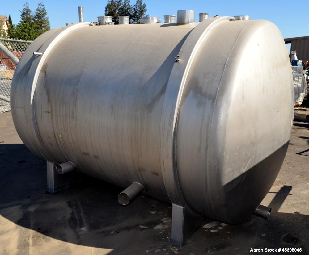 Used Tank, 1400 Gallon, Stainless Steel, Horizontal. 66" Diameter x 82" straight side, dished heads. Openings top (3) 1-1/2", 2", (2) 3", (2) 4", 6", heads 1-1/2", (2) 4" outlets, 18" man way with co...