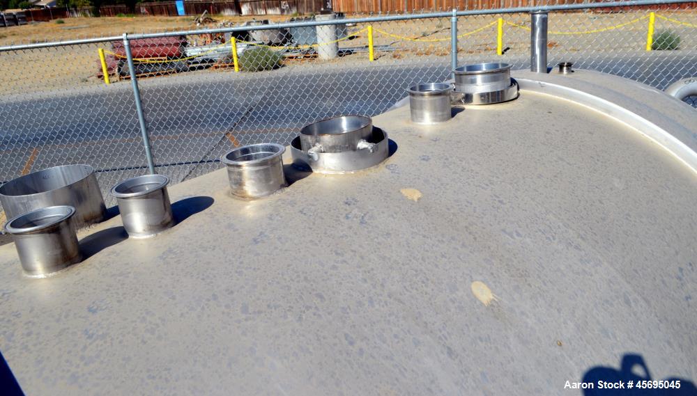 Used Tank, 1400 Gallon, Stainless Steel, Horizontal. 66" Diameter x 82" straight side, dished heads. Openings top (3) 1-1/2", 2", (2) 3", (2) 4", 6", heads 1-1/2", (2) 4" outlets, 18" man way with co...