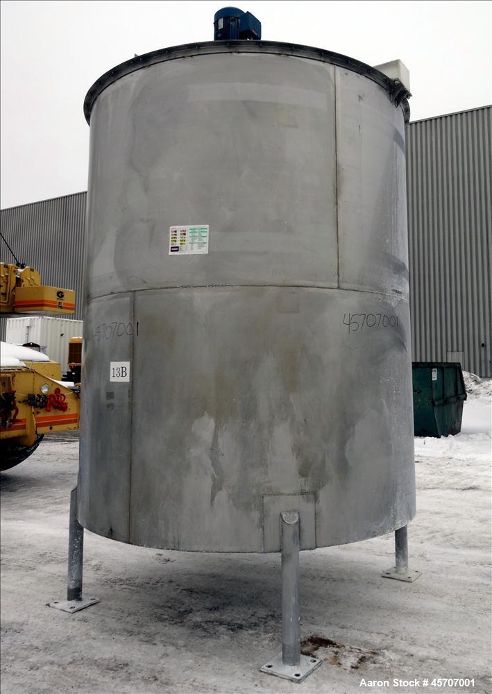 Used Bright Sheet Metal Tank, Approximately 4,000 Gallon, 304 Stainless Steel, Vertical. 100" diameter x 120" straight side. Flat top, coned bottom. 34" x 32" top hinged manway cover, 2" center botto...